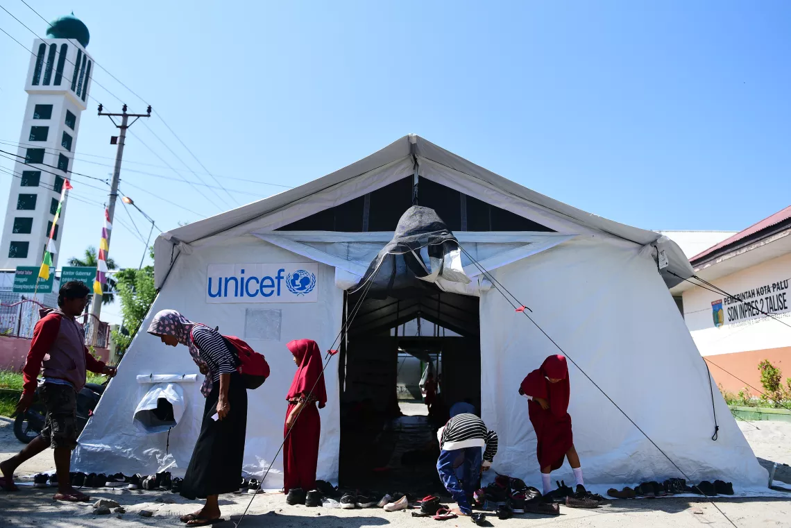 Indonesia earthquake and tsunami. Students outside their temporary UNICEF school tent. 