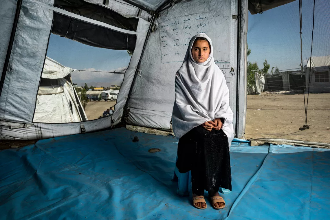 Afghanistan. A girl sits in a community based education tent.