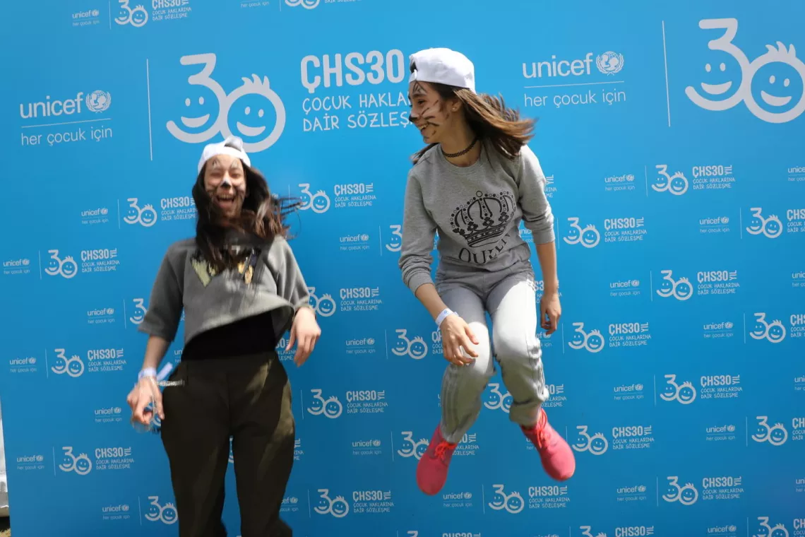 Two girls jumping