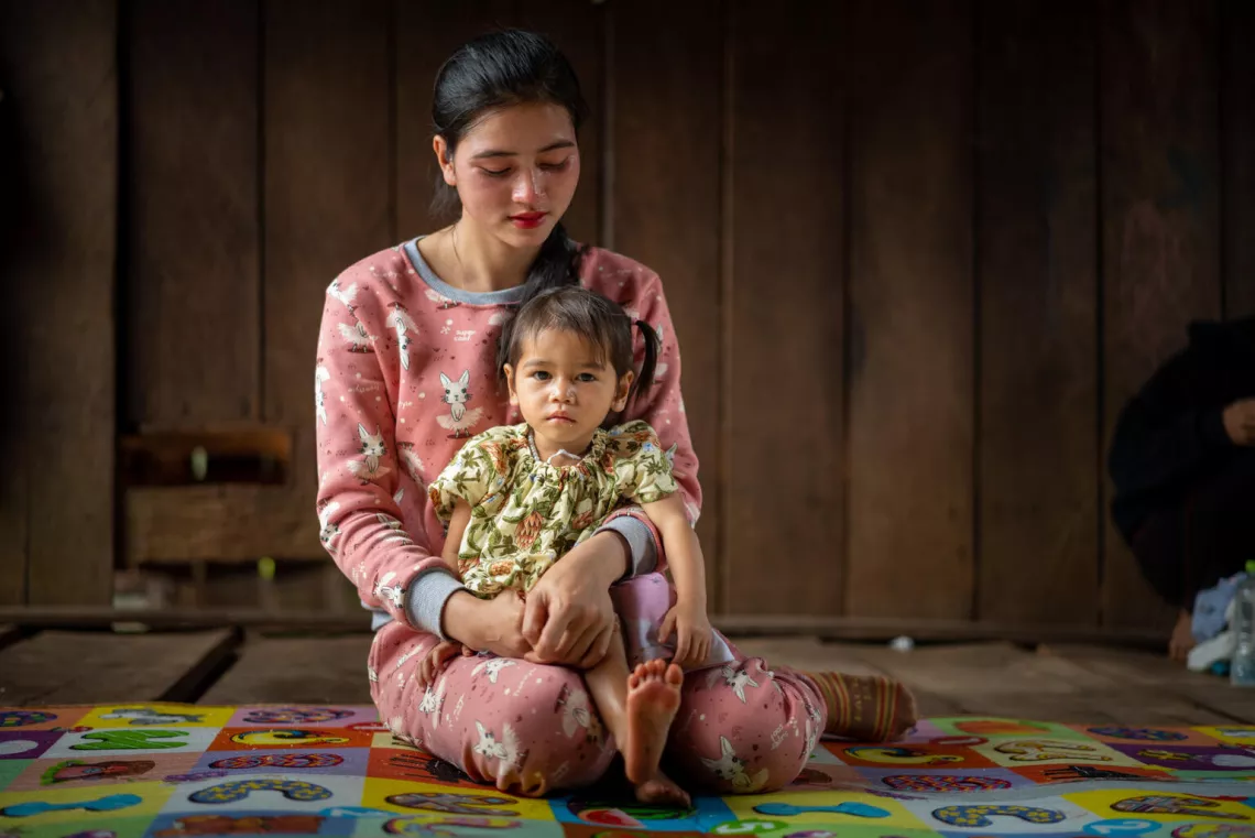 Cambodia. A woman holds her daughter who suffers from severe acute malnutrition.