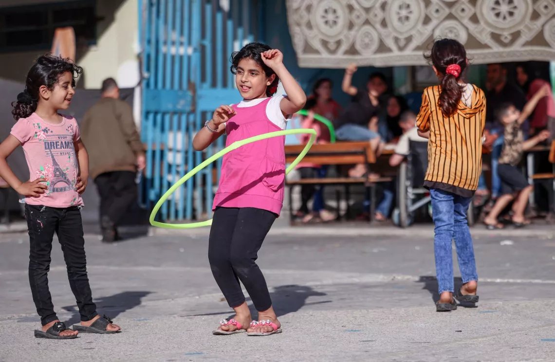 Gaza. Children play at a school being used as a temporary shelter.