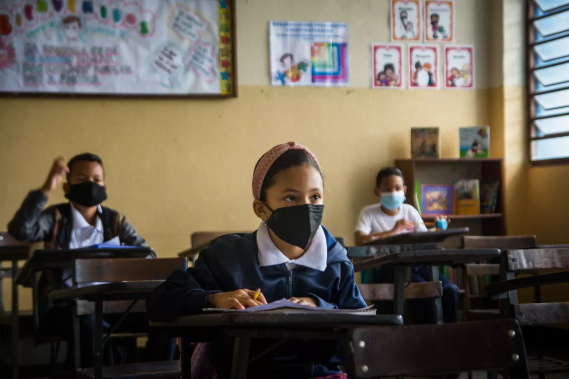 Children study during classes at a school in Caracas, Venezuela.