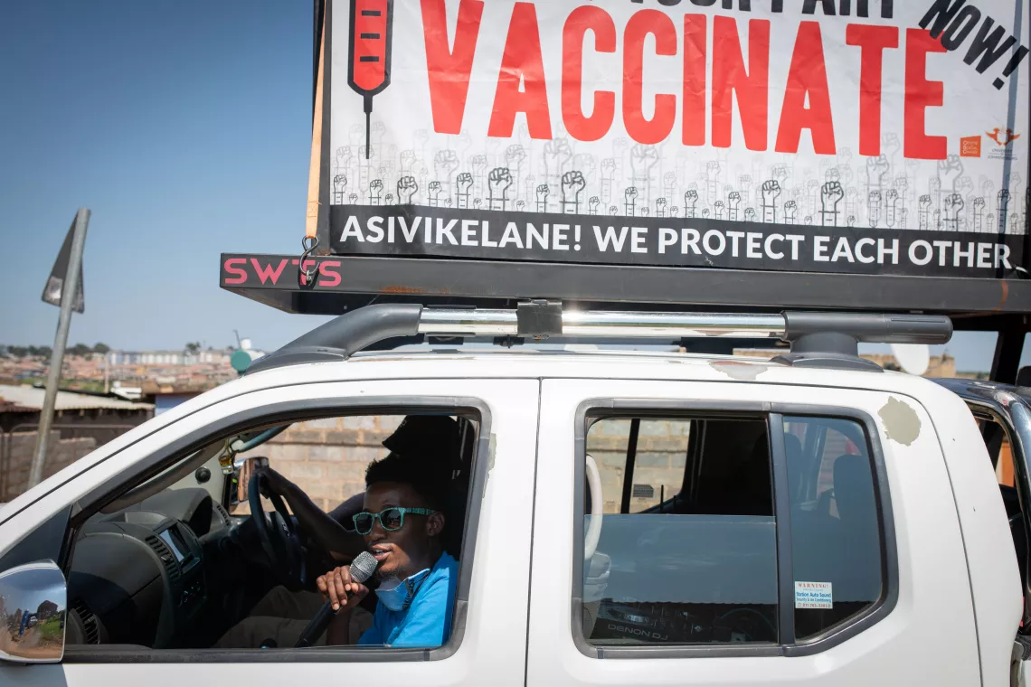 On 11 February 2022, Thabiso Mathetse, a mobilizer with the &ldquo;Zwakala&rdquo; campaign, uses a PA system mounted on a truck to encourage people to get vaccinated at a pop-up vaccination site in Riverside, Ivory Park, Thembisa, South Africa.