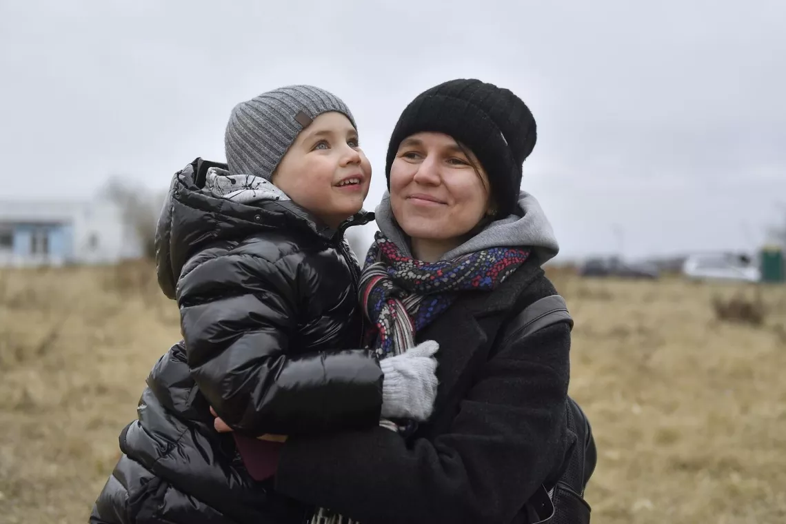 Ukrainian mother and her son at the Siret border crossing in Romania.