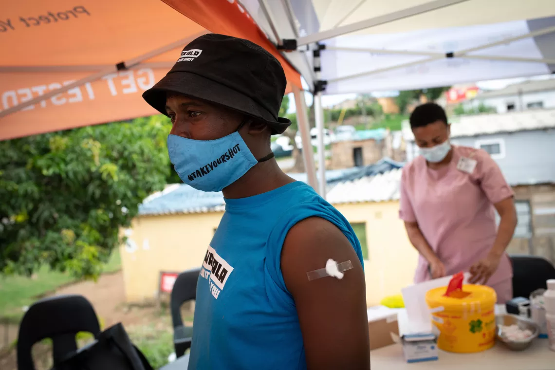 Siyabonga Maphumalo, a mobilizer with the Zwakala campaign, takes the lead and receives a dose of the COVID-19 vaccine.  