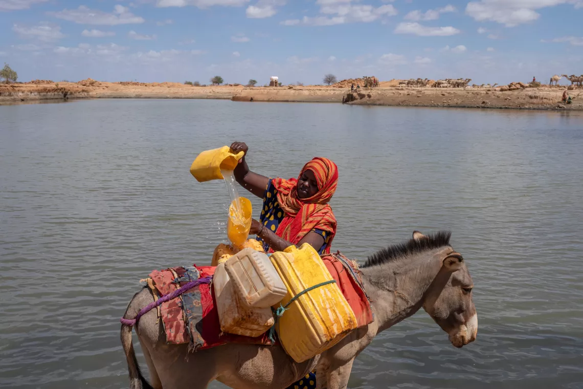 Dama Mohammed collects water from a pond in Beda&rsquo;as kebele, Ethiopia
