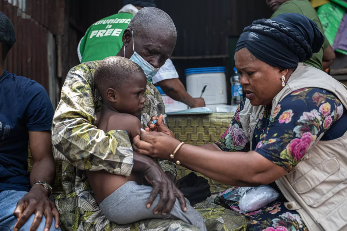 4-year-old Fawaz Idris receives his first vaccination, a Bacillus Calmette&ndash;Gu&eacute;rin (BCG) vaccine against tuberculosis, administered by Bolanle Orefejo, UNICEF Vaccine Security and Logistics Consultant, in the Gengere community of Kosofe Local Government Area in Lagos, Nigeria.
