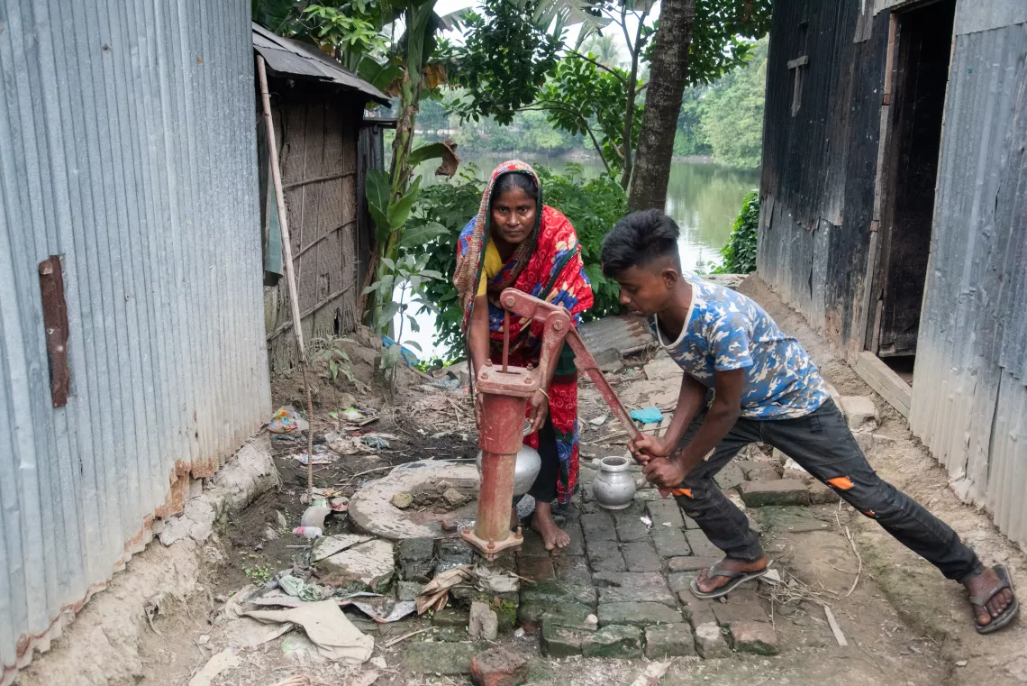 Al-Amin helps his mother Jafura Begum with household work.