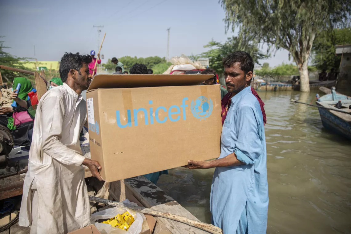 Pakistan. Essential health supplies are transported by boat in Sindh Province, Pakistan, following massive flooding.