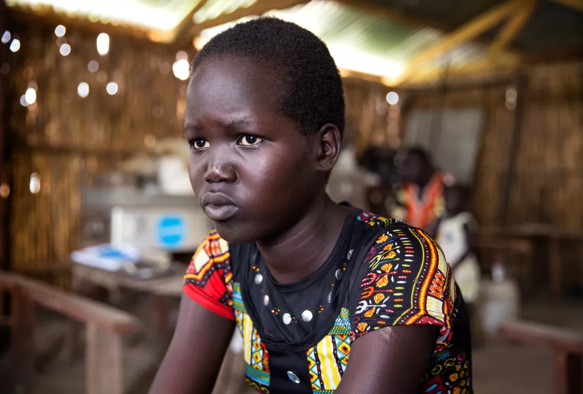 Mary Nyakuma Peter, 15, sits in a classroom