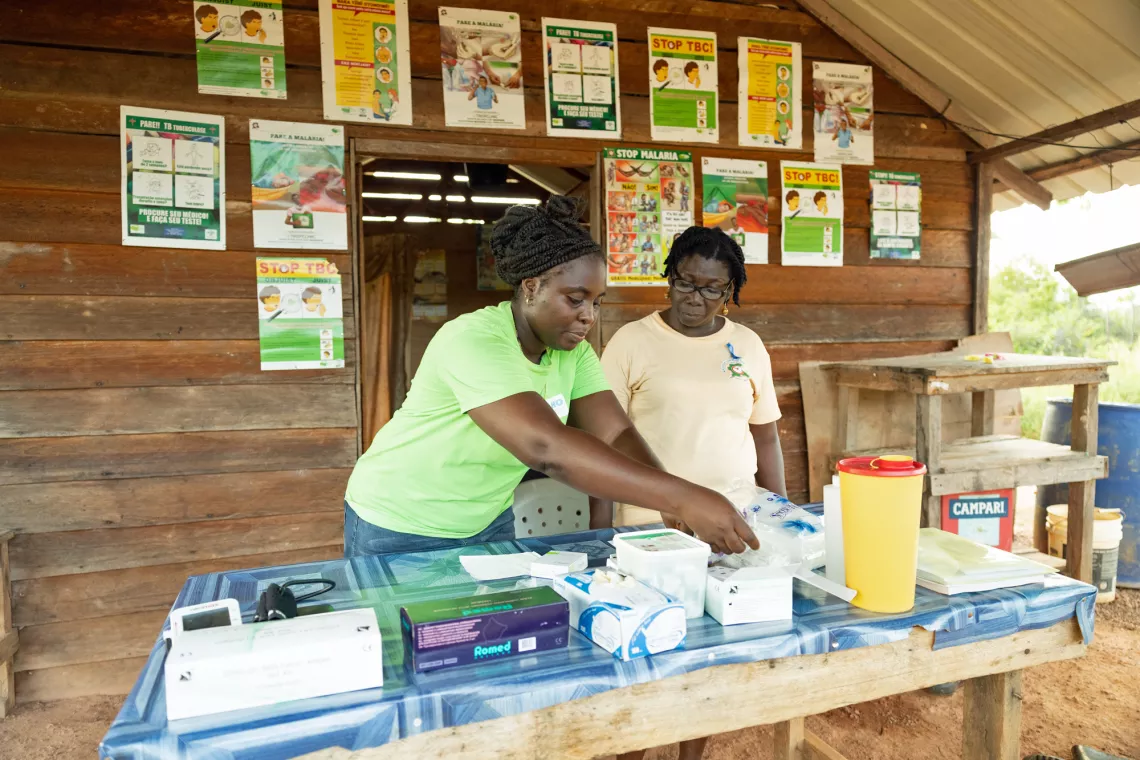 Hortance Nelson (Microscopist Superviser) doing rapid COVID test training with Margo Schoonland (MSD) in Pikin Saramacca Suriname. Margo turned her home into a remote clinic where she tests and treats patients for COVID, Malaria and TB.