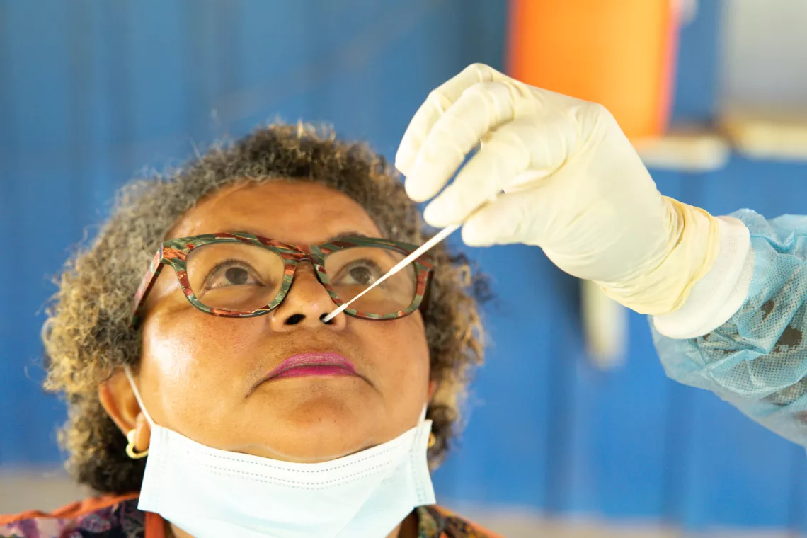 Iramar do Socorro is given a rapid COVID-19 test thanks to this community testing initiative. 