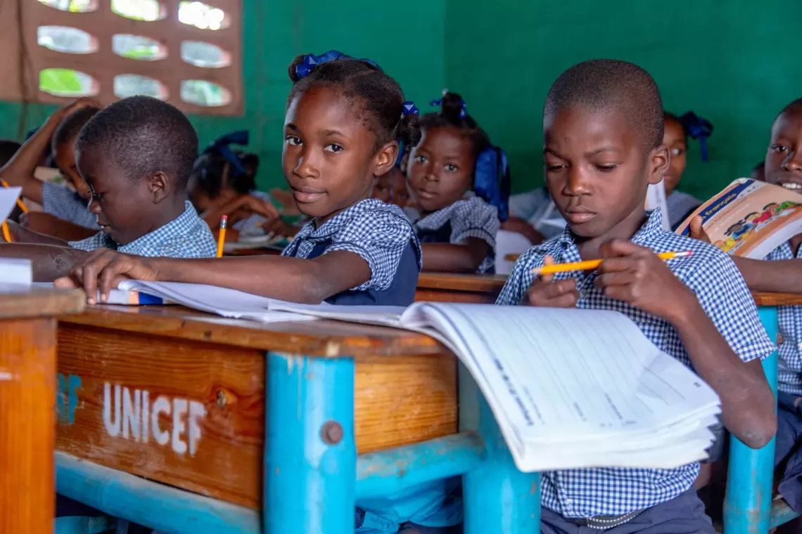 Students in Haiti receive school kits.