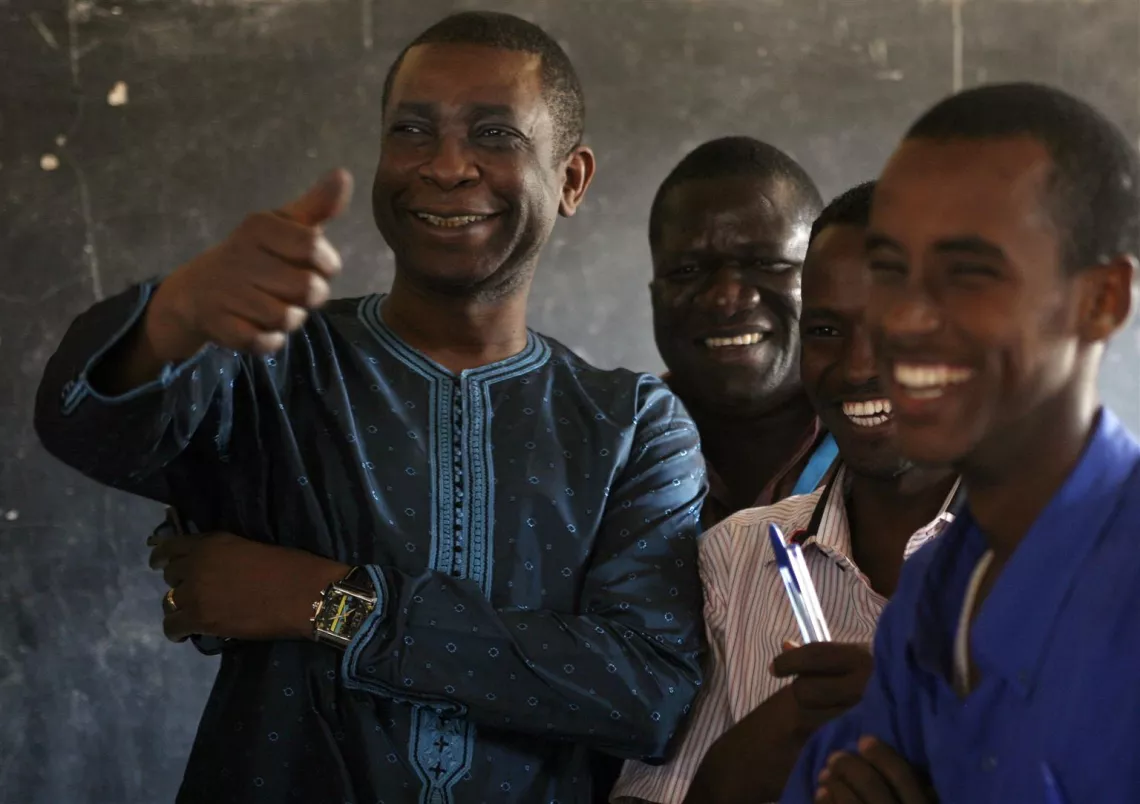 On 5 September, UNICEF Goodwill Ambassador Youssou N&rsquo;Dour (left) smiles and makes a thumbs-up gesture while meeting students at a school in the Dagahaley refugee camp, in the north-eastern town of Dadaab, Kenya.