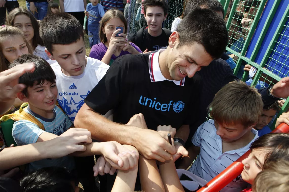 UNICEF National Ambassador for Serbia Novak Djokovic autographs children&rsquo;s outstretched hands during his visit to Pcelica (&lsquo;Little Bee&rsquo;) Nursery School in the town of Smederevo, near Belgrade, Serbia.