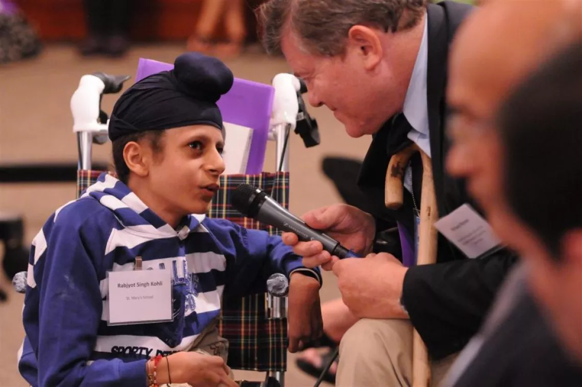 A child delegate is interviewed.