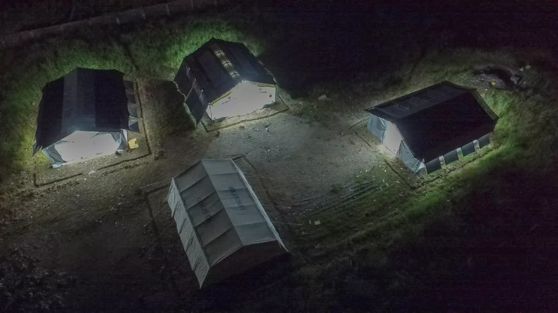 Philippines. Lights shine from inside prototypes of a High Performance Tent being tested in Cotabato, Philippines, where UNICEF and manufacturers analysed performance in hot, humid and rainy conditions.