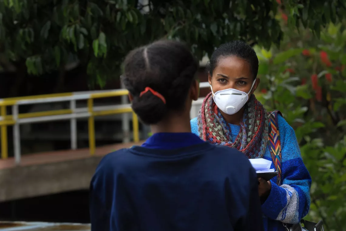 Ethiopia. A social worker talks with a teenager.