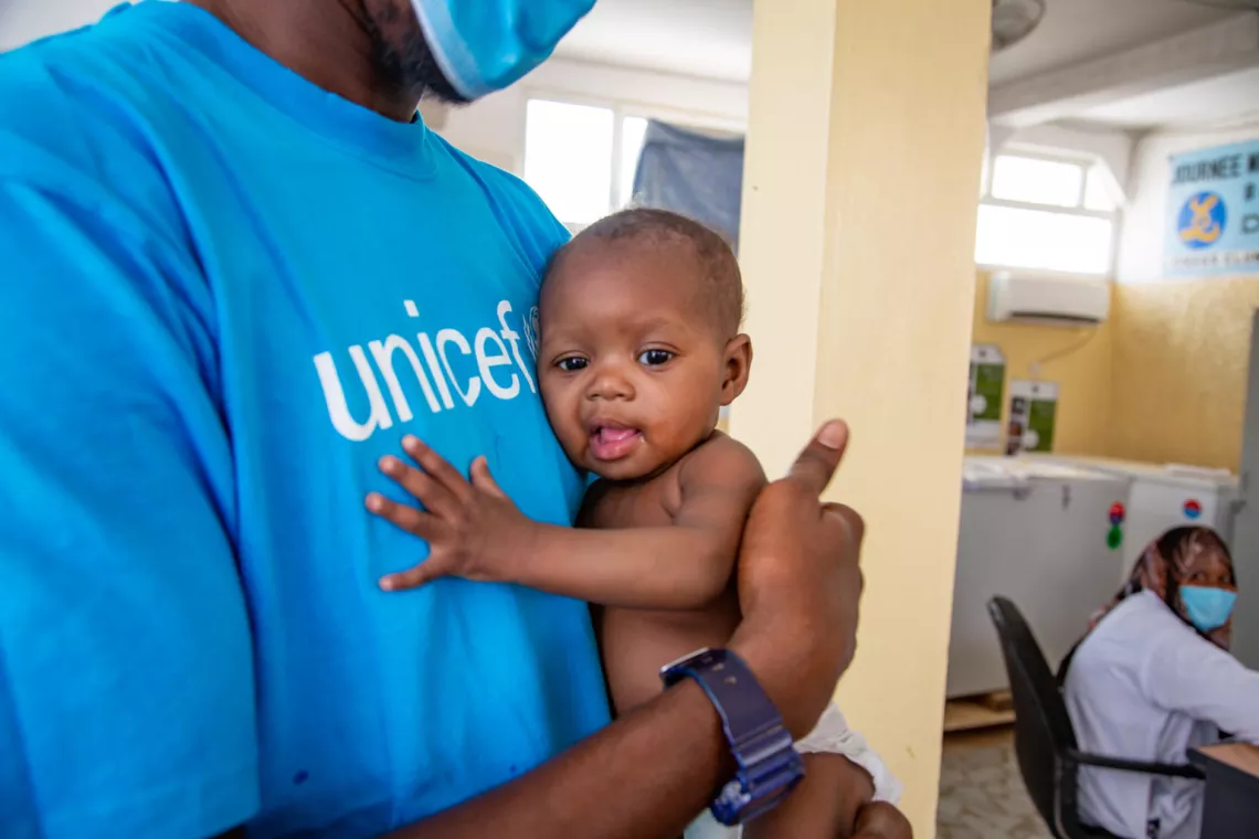 Mauritania. A UNICEF nutrition specialist holds a malnourished baby at a nutrition rehabilitation centre.