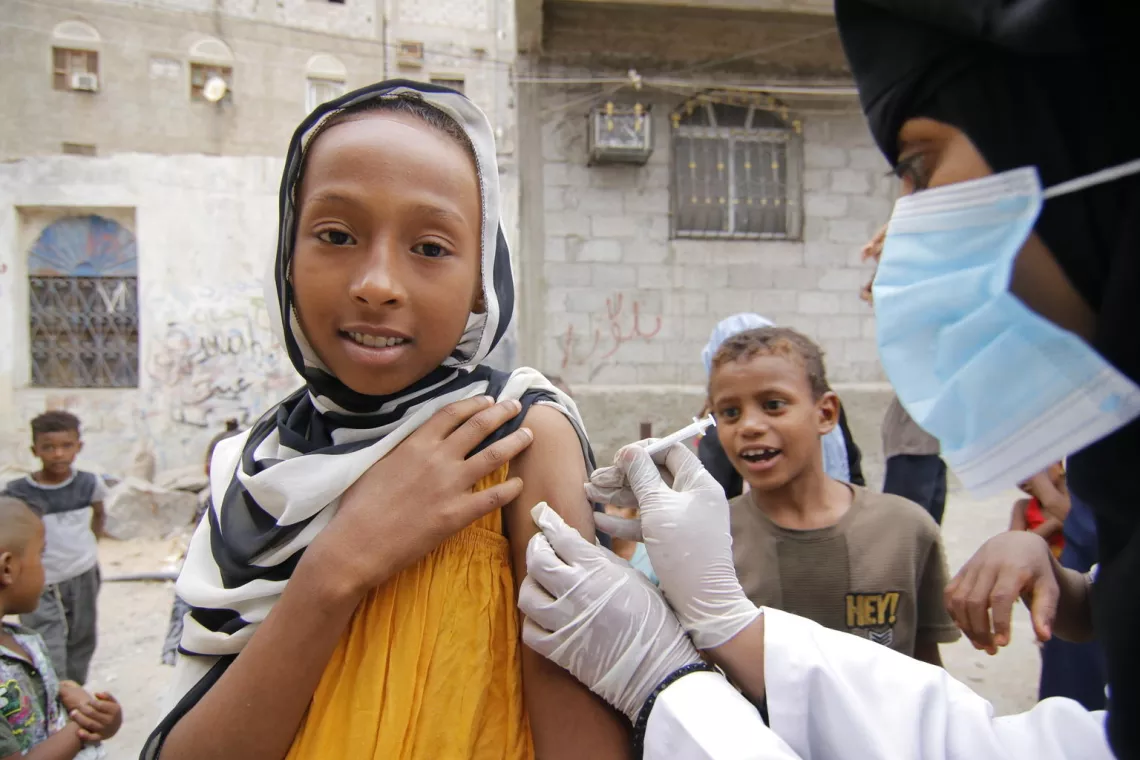 Yemen. A child receives a diphtheria vaccine.