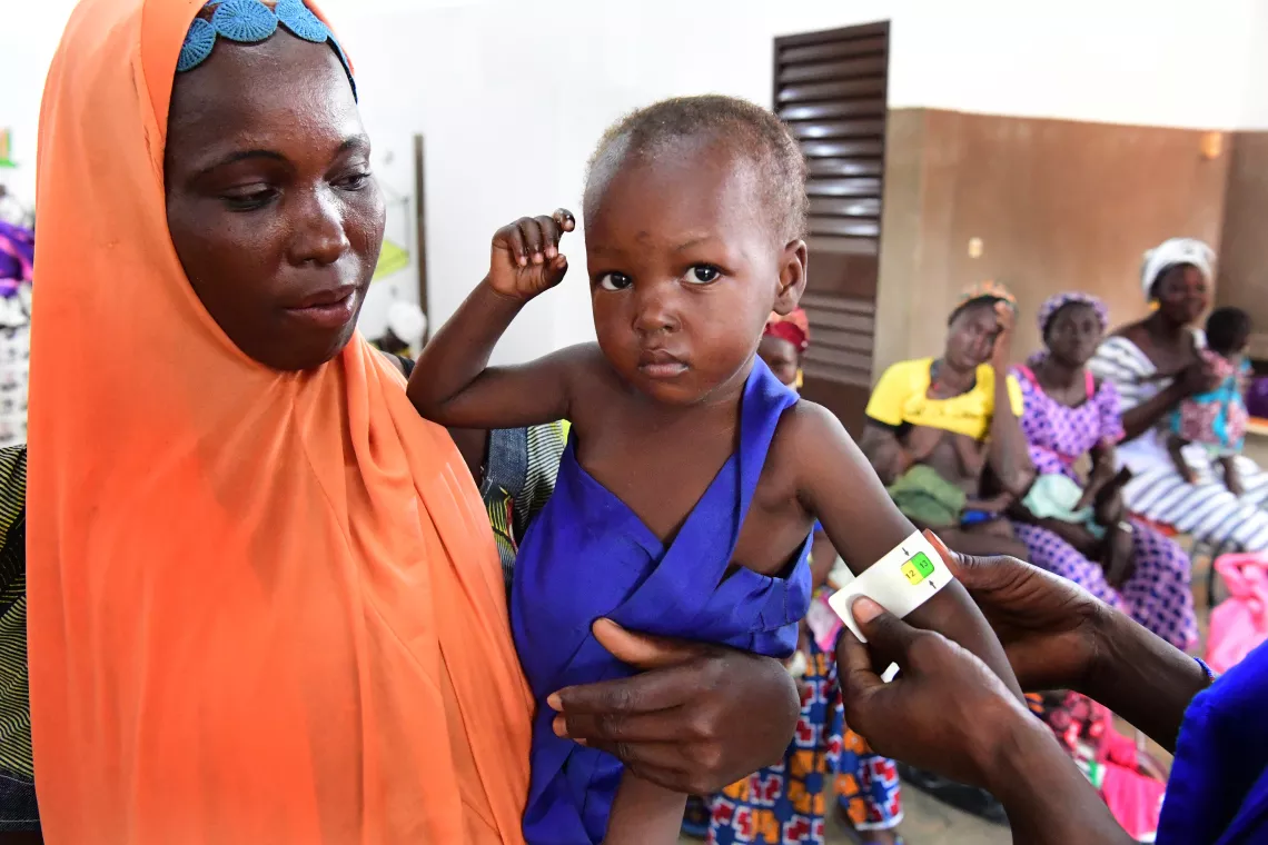 Burkina Faso. A child is check for malnutrition.