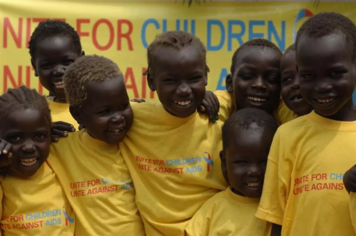 Children hug at the launch of the "Unite for Children, Unite against AIDS" campaign.