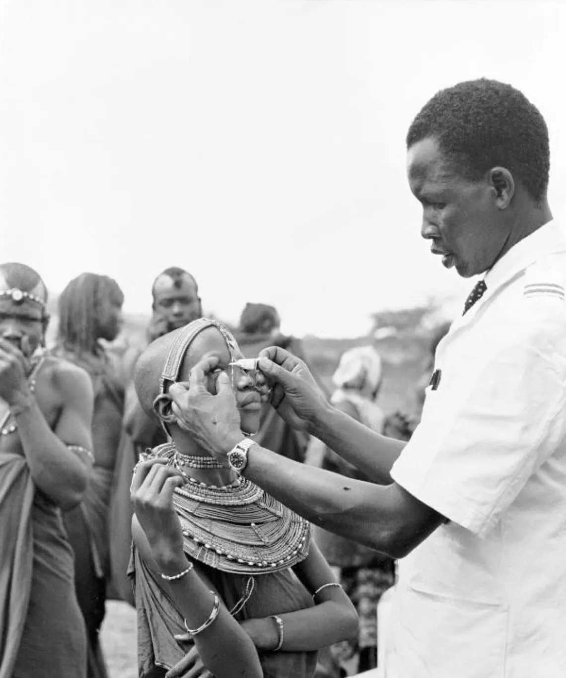 A health worker treats a child with trachoma.
