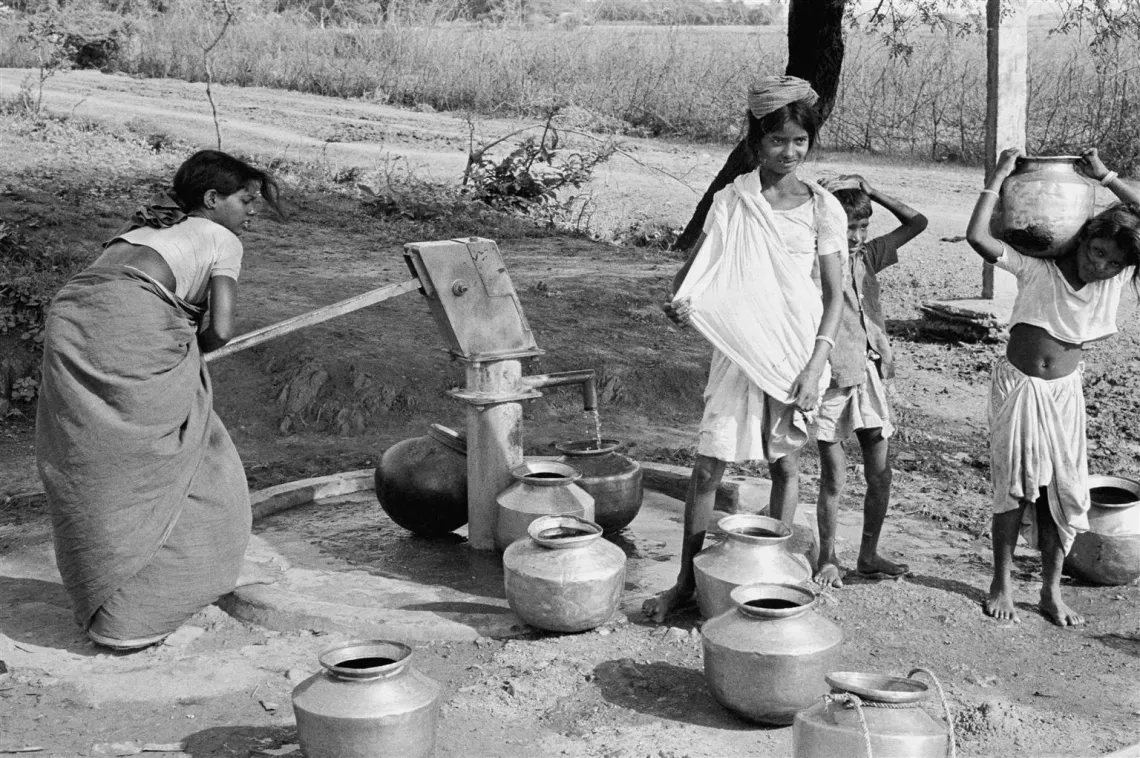 Children collect water at a Mark II handpump.