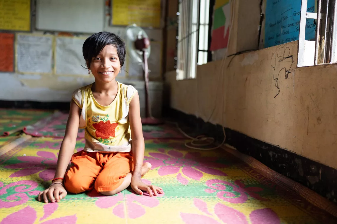 Bangladesh. Shahida, 10, smiles for the camera at a Multi-Purpose Centre in a Rohingya refugee camp in Cox&rsquo;s Bazar.