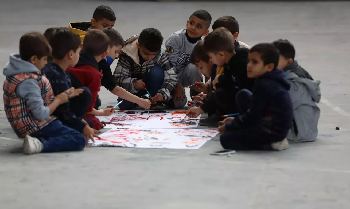 Boys paint during UNICEF-supported activities in Jenin refugee camp, north of the&nbsp;West Bank.