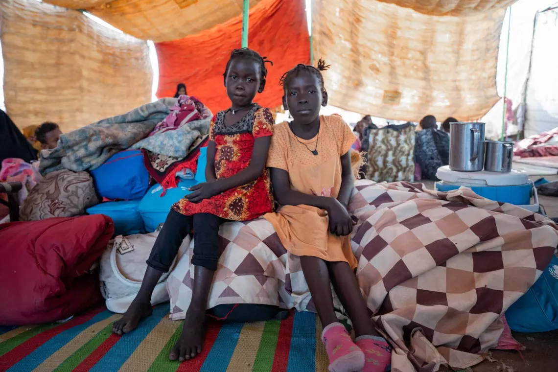Ebtihal, 10 years old (R), and Mab, 6 years old (L), with their family have been displaced for the second time following the recent clashes in Gezira state.