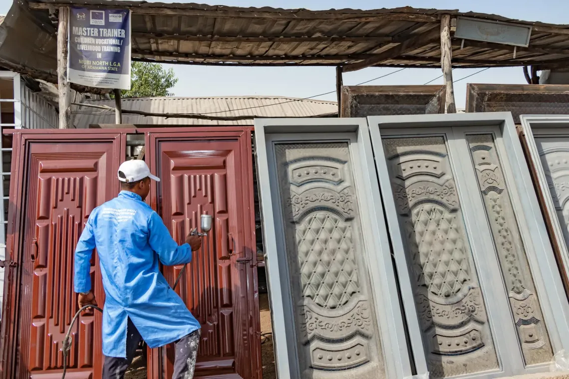 Nigeria. A child formerly associated with an armed group learns welding.