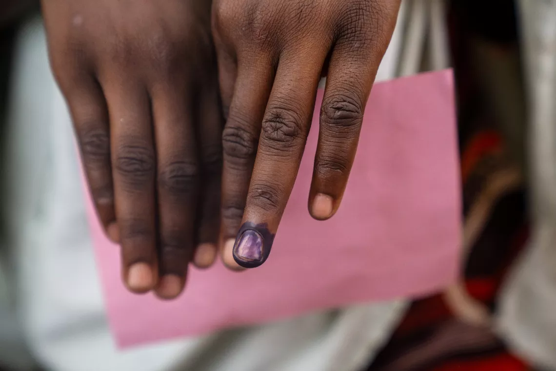 A girls finger is marked after receiving the human papillomavirus (HPV) vaccine at a mobile clinic in Katsina, Nigeria on 29 May 2024.