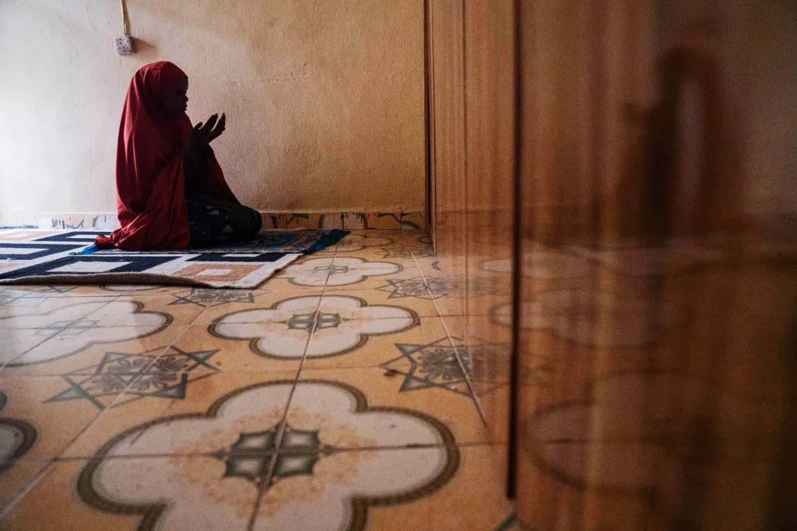 Volunteer Community Mobilizer (VCM), Shamsiyya Abdullahi Jariri, 30, takes part in afternoon prayers in Katsina, Nigeria on 30 May 2024.