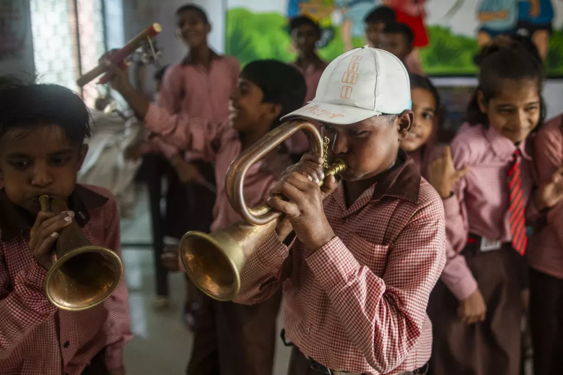 Children playing instruments.