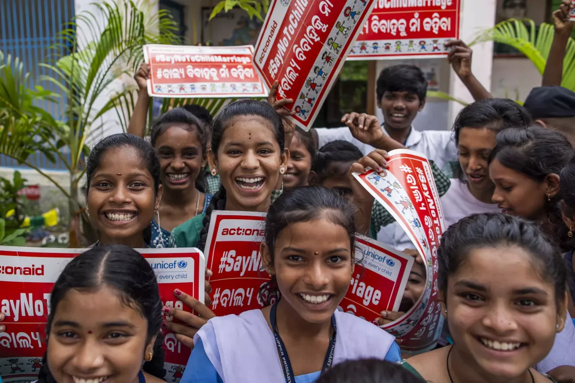 Students hold up 'Say no to child marriage' posters at the Anganwadi Centre after an Advika meeting.