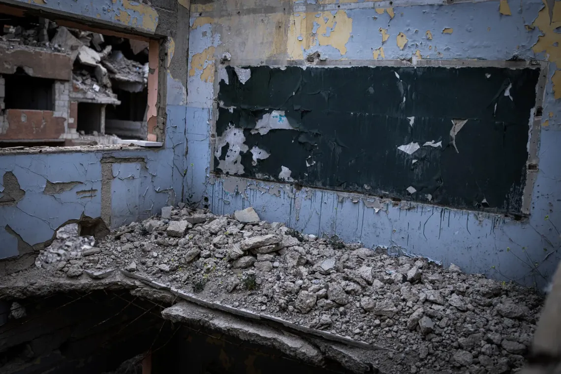 Syria. A badly damaged classroom is pictured in Douma.