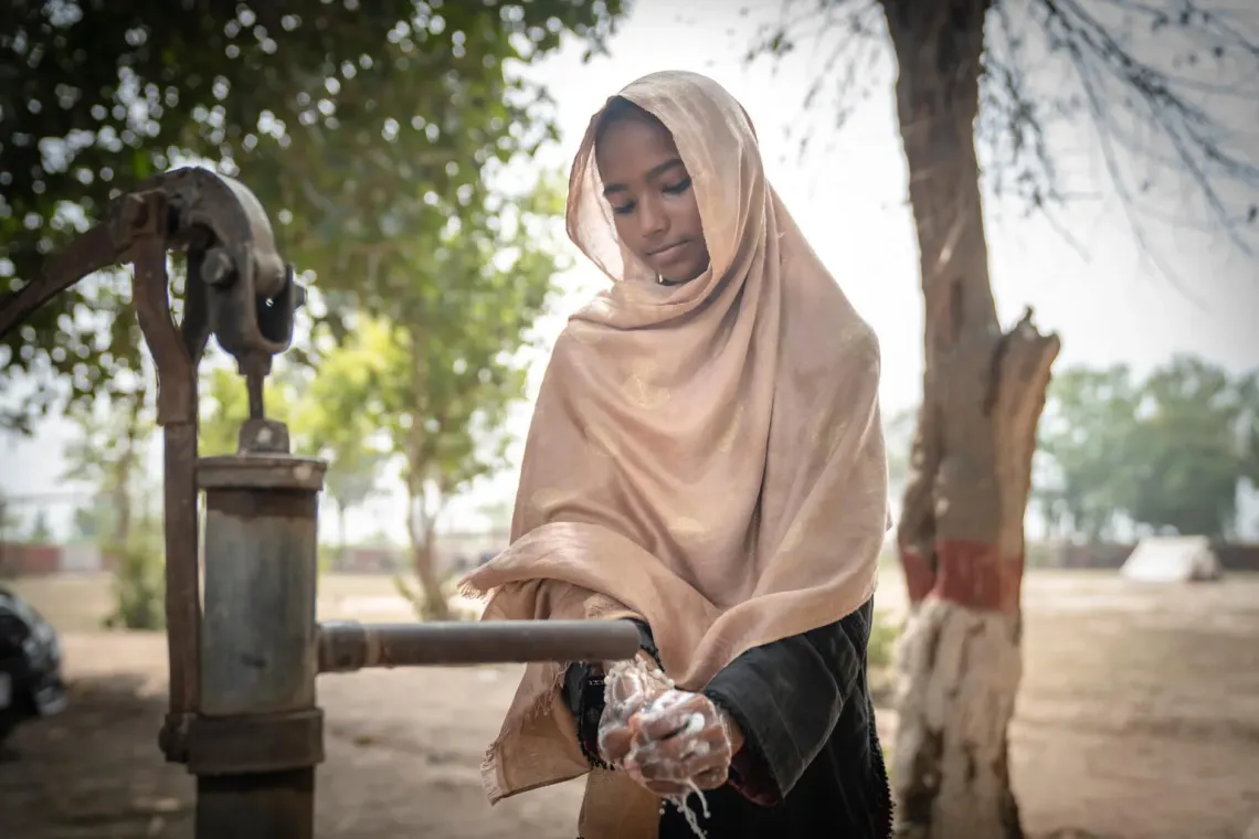 Pakistan. A girl washes her hands with soap provided by UNICEF in flood-affected Korewala Village, Kasur District, Punjab.