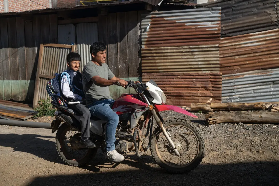 Peru. Hansel and his father, Jhon, ride home from Hansel&rsquo;s school in Ayacucho.
