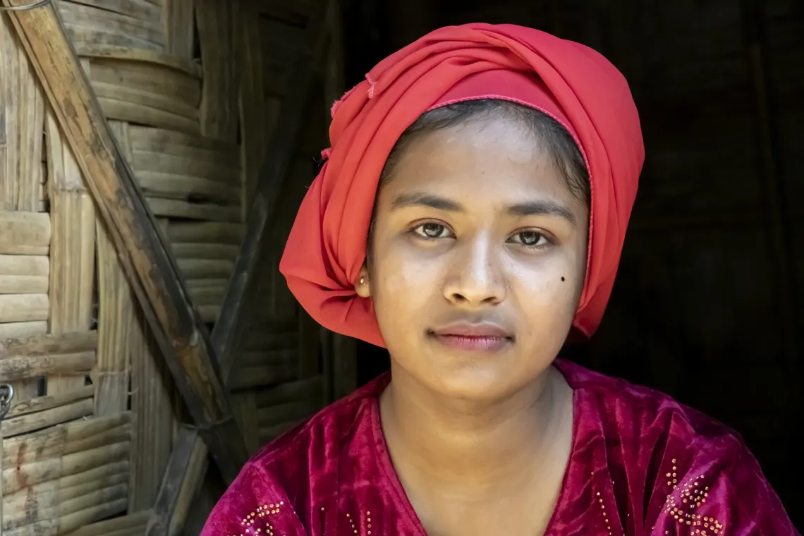A girl in a red head dress