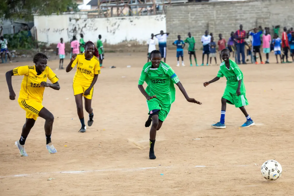 Girls playing football