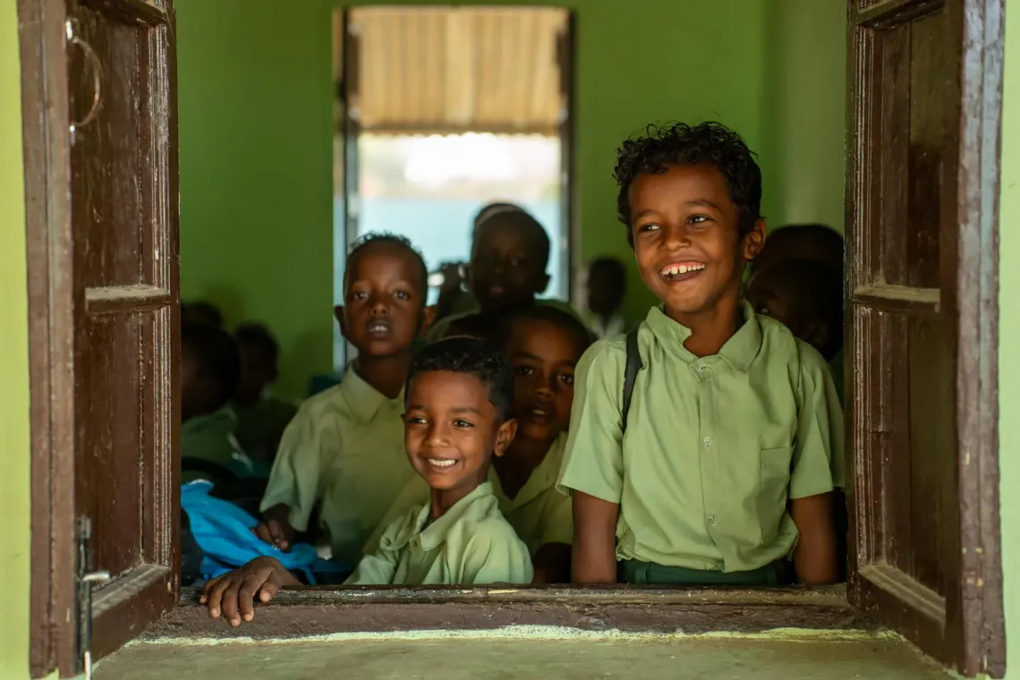 Sudan. Children look out through a classroom window at a school in Kassala State.