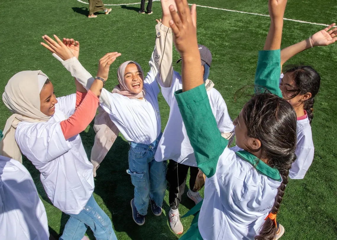 Girls playing football