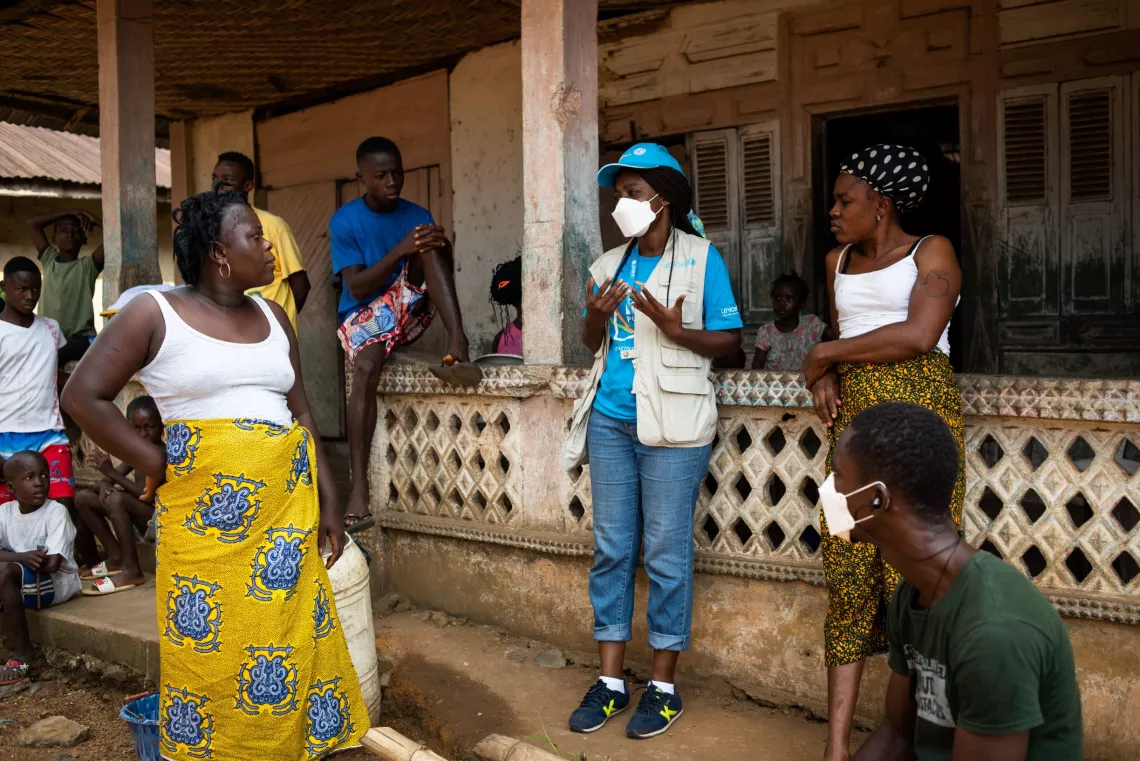 Liberia. a UNICEF Communication for Development consultant speaks with local mothers.