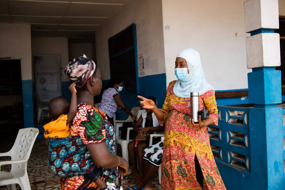 Liberia. A community mobilization officer with Liberia&rsquo;s Ministry of Health speaks with a mother.