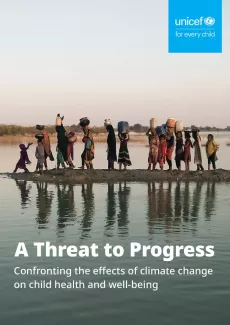 young girls crossing the river in search of drinking water