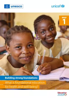 Happy school girls in class