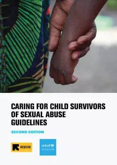 A child's hand being hold by an adult