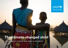 A mother and daughter look out over submerged houses in Panyagor in Twic East, Jonglei State in South Sudan.