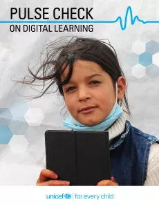 A refugee child in Jordan receives a tablet